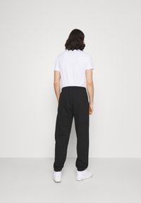 Levi's® TAB PANT - Trainingsbroek - mineral black