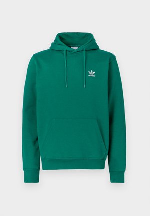 Zaļš džemperis ar kapuci no mīkstas auduma, ar priekšējo kangaru kabatu, regulējamu kapuces auklu un nelielu balto Adidas logo krūšu rajonā.