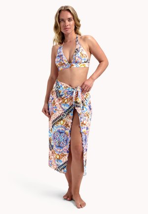 Bikini set with a halter neck in colorful floral patterns; paired with a long sarong featuring a side slit and tie detail.