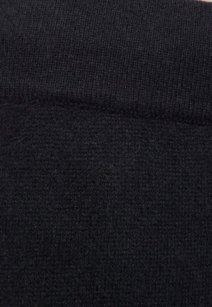 Tissu tricoté noir avec une texture douce. Présente un motif côtelé en haut. Dans l'ensemble, le matériau a une surface lisse et homogène.