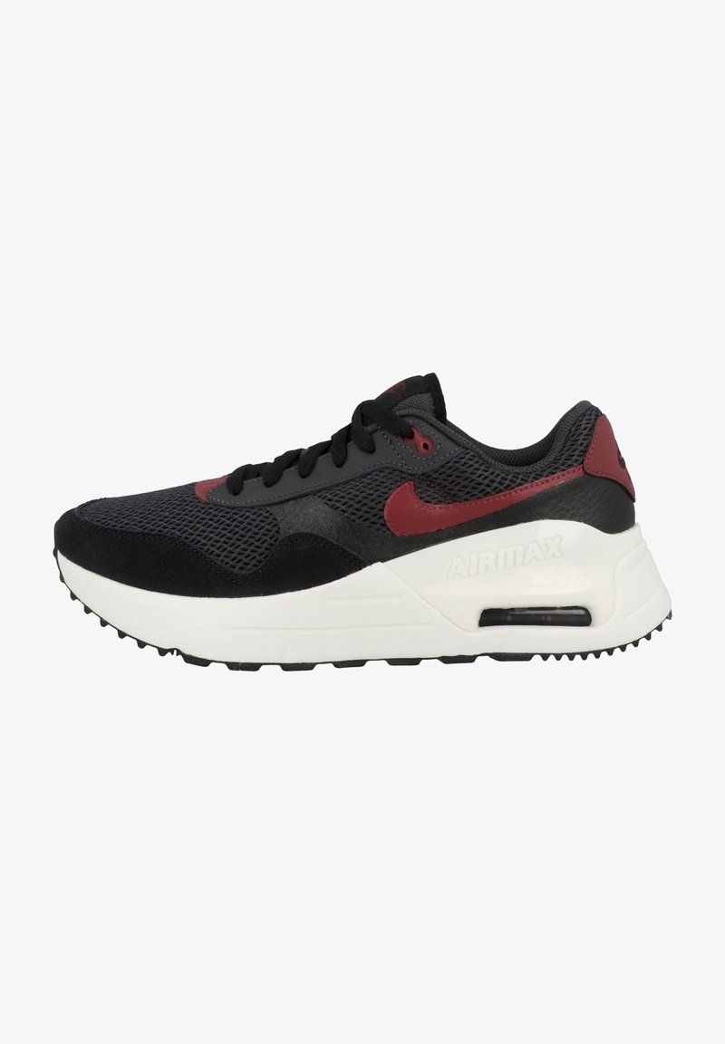 Black athletic sneaker with red accents, mesh and suede materials, round toe, lace-up design, and a white cushioned midsole.