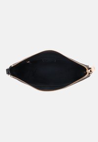 Black leather handbag with a zip closure, smooth exterior, and a spacious interior featuring a soft black lining. Gold-tone hardware accents.