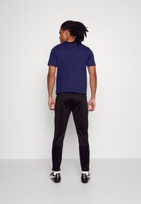 Puma - FUSSBALL PARK PANTS - Jogginghose - black - 2