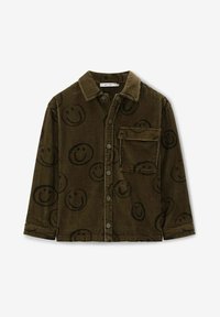 Groen corduroy shirt met zwart smiley gezicht patroon, voorknoopsluiting, kraag en één borstzak. Zachte textuur en relaxte pasvorm.