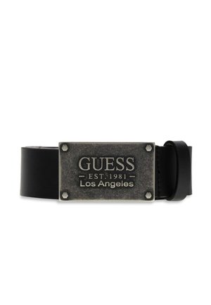 Ceinture en cuir noir avec boucle métallique rectangulaire gravée "GUESS EST. 1981 Los Angeles" et quatre détails de boulons aux coins.