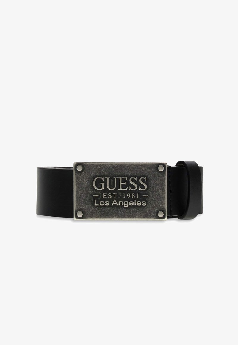Ceinture en cuir noir avec boucle métallique rectangulaire gravée "GUESS EST. 1981 Los Angeles" et quatre détails de boulons aux coins.