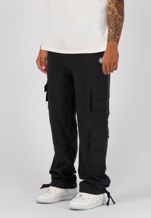 MONOGRAM TECH - Cargo trousers - black