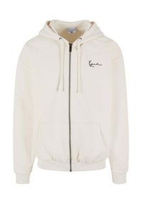 Light cream hoodie with a front zipper, adjustable drawstrings, and logo embroidery on the chest. Made from a soft, textured fabric.