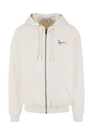 Jasny kremowy hoodie z zamkiem błyskawicznym z przodu, regulowanymi sznurkami i haftowanym logo na piersi. Wykonany z miękkiego, teksturowanego materiału.