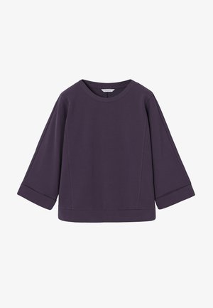 Haut violet à manches longues avec manches larges, col rond et extrémités à poignets, présenté sur un fond blanc.