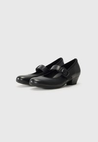 Black leather Mary Jane shoes with a rounded toe, small buckle accent, and a low, chunky heel. Smooth texture, simple design.