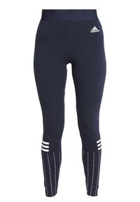Granatowe legginsy sportowe wykonane z elastycznego materiału, z wysokim stanem, białymi trzema paskami i pionowymi białymi liniami.