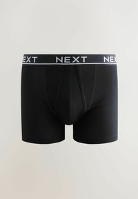 Boxer-briefs en coton noir avec une large ceinture élastique noire et grise portant le texte "NEXT". Texture lisse et design ajusté.