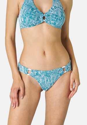 Completo bikini turchese con motivi floreali bianchi. Il top presenta un dettaglio a chiave e il fondo ha accenti circolari sui lati.