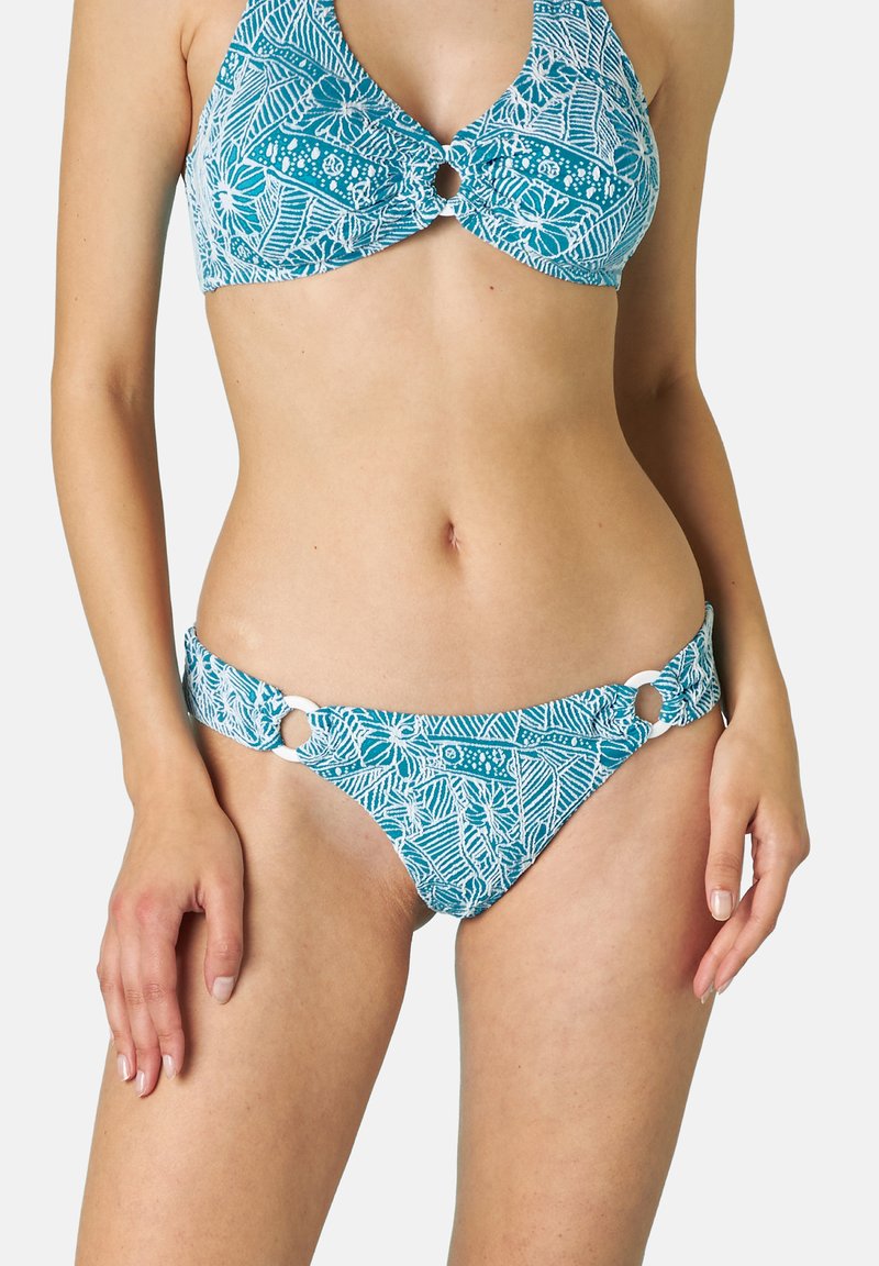 Completo bikini turchese con motivi floreali bianchi. Il top presenta un dettaglio a chiave e il fondo ha accenti circolari sui lati.