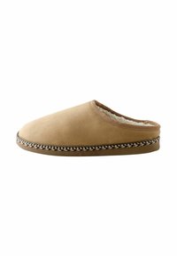 Brown slipper with soft suede upper, cozy faux fur lining, rounded toe, and decorative braided trim along the sole.