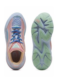 Kevekk lightweight running shoes with a multi-color mesh upper, prominent laces, cushioning sole, and textured rubber outsole in pastel colors.