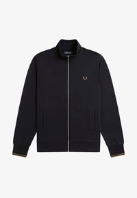 Giacca zip-up blu navy con colletto alto, realizzata in tessuto morbido. Presenta tasche laterali e un emblema dorato sul petto. Polsini rifiniti in colore contrastante.
