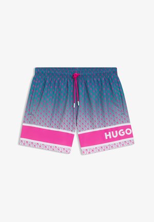Costume da bagno con motivo di palme turchese e rosa, coulisse rosa, ampie strisce rosa vicino all'orlo e "HUGO" stampato sulla gamba sinistra.