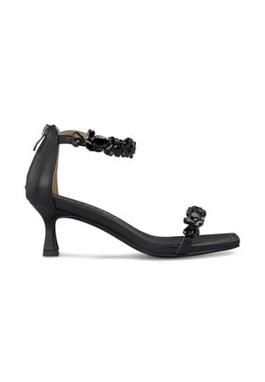 Black high-heeled sandal with an ankle strap, embellished with black stones, square toe, and a tapered heel design. Smooth leather material.
