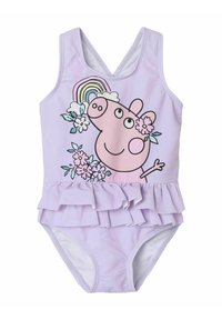 Lila baddräkt med volang, med en rosa tecknad gris omgiven av blommor och en regnbågsdesign. Tillverkad av elastiskt tyg.
