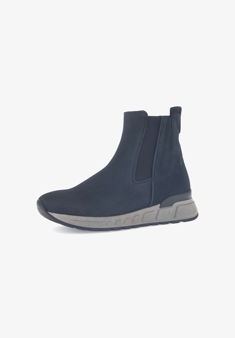Botas de tobillo negras con una textura suave, paneles laterales elásticos y una suela de goma gris con un diseño de múltiples capas para mayor tracción.