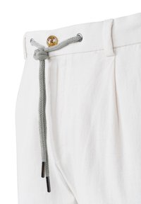 Light-colored linen pants featuring a braided grey drawstring, a gold-tone button, and pleats for added structure. Smooth texture.