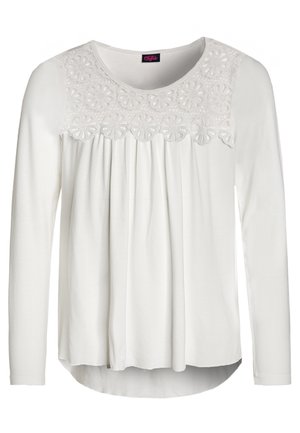 White long-sleeve blouse with round neckline, floral lace yoke, and vertical pleats below the yoke on the front.