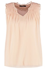 Blouse sans manches rose pâle avec épaules volantées, corsage supérieur froncé et encolure en V.