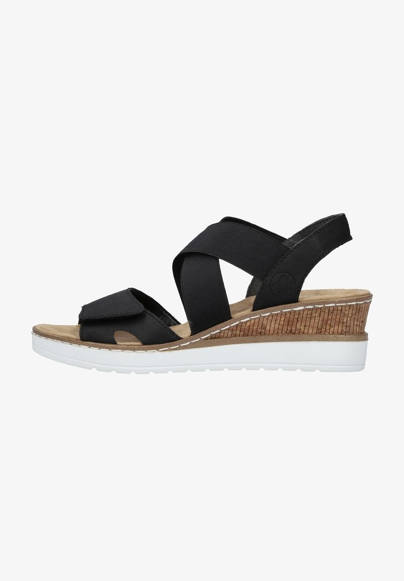 Black wedge sandals with elastic cross straps, a cork-textured wedge heel, white rubber outsole, and a cushioned footbed.
