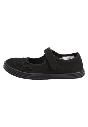 Chaussure Mary Jane noire avec bride ajustable, broderie papillon sur l’avant-pied et semelle en caoutchouc texturée, conçue pour un usage décontracté.