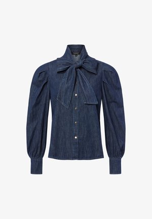 Denim blouse in dark blue, featuring a bow tie collar and puffed sleeves. Five button front with silver-tone buttons, textured fabric.
