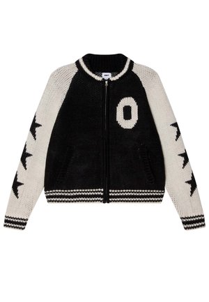 Schwarze und cremefarbene Strickjacke mit einem gemusterten Design. Mit einem Reißverschluss, gerippten Bündchen und einem großen "O" auf der Vorderseite. Sternmuster an den Ärmeln.
