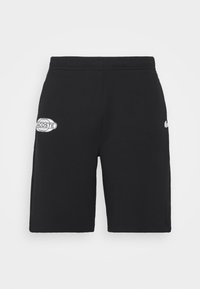 Shorts noirs mi-longs avec taille élastique et patches blancs du logo Lacoste sur les côtés gauche et droit.