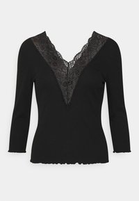Black long-sleeve top with a deep V-neckline, featuring intricate black lace trim and a scalloped hem. Smooth texture and fitted design.