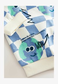 Ei valittu, blue on white