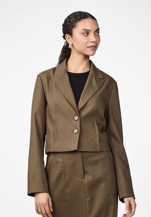 Cropped brown blazer with a notched collar, two buttons, and long sleeves. Fabric has a smooth texture, matching tailored skirt visible.