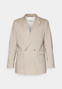 Light beige double-breasted blazer with a textured finish, notched lapels, and two front pockets, featuring brown buttons on the front.