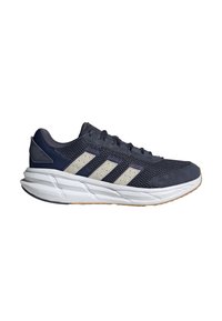 Granatowe buty sportowe z siateczkową cholewką, białą podeszwą środkową i trzema jasnoszarymi paskami po bokach. Posiadają wyściółkę w okolicy pięty oraz teksturowaną gumową podeszwę.