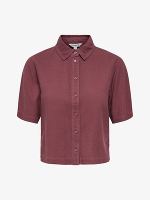 Kortermet skjorte med knapper i dempet lilla farge, med klassisk krage og en lett avkortet nederkant.