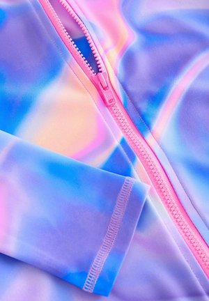Leichtes, dehnbares Material in Pastellfarben mit einem wirbelnden Muster. Verfügt über einen rosa Reißverschluss und Flachnahtnähte entlang der Nähte.
