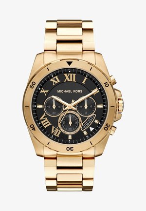Montre Michael Kors en ton or avec cadran noir, chiffres romains, trois sous-cadrans, fenêtre de date et bracelet en métal à maillons.