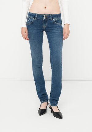 Dark blue skinny jeans with a smooth denim texture, featuring a mid-rise waist, two front pockets, and silver button hardware.