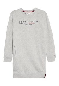 Harmaa college-paita, jossa on pyöreä kaula-aukko, pitkät hihat ja sivuhalkio. Tarjoaa painetun "TOMMY HILFIGER NEW YORK" -logon meripenkin ja punaisilla yksityiskohdilla.