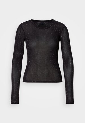 Camisola preta de manga longa, feita de um tecido transparente, com um design ajustado e adornada com pequenos pontos prateados por todo o lado. Decote redondo.