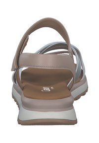 Sandali open-back in beige con fasce multicolore. Soletta morbida, suola ammortizzata e dettagli testurizzati sulla suola. Si regolano con una fibbia in velcro.