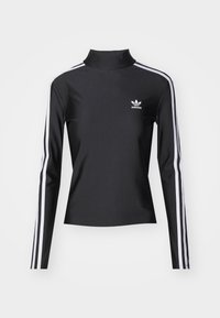 Zwart lange mouw top met een hoge kraag, gemaakt van gladdig materiaal. Heeft witte zijstrepen en een klein wit logo op de borst.