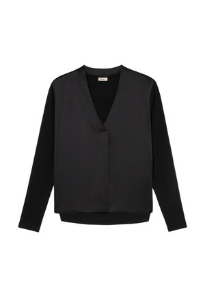 Top noir à manches longues avec un col en V, présentant un devant en satin et un dos mat, conçu avec une coupe décontractée et des coutures minimales.