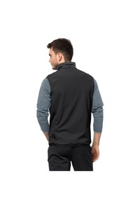 Black vest with a high collar, lightweight material, elastic waistband, and ribbed gray long sleeves visible underneath, designed for layering.