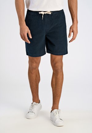 Marineblå kordfløjlsshorts med en afslappet pasform, elastisk talje og snor. Har opbrettede ærmer og sidelommer.